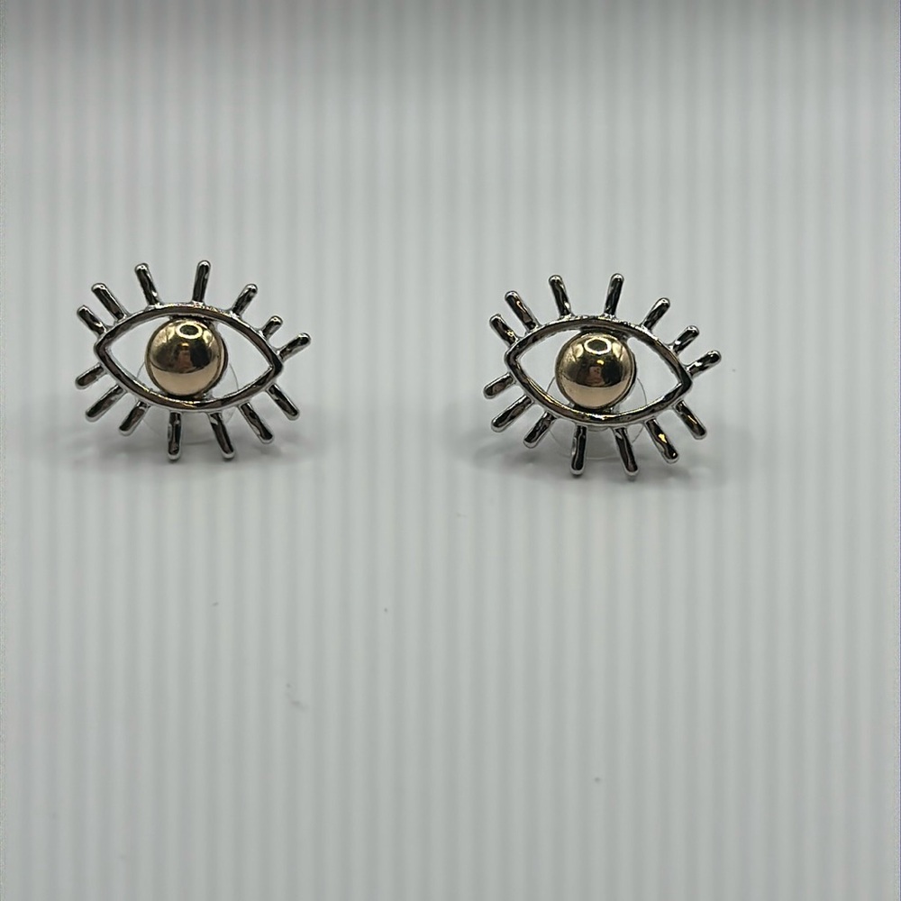 Silver eye-shaped earrings with gold-colored center